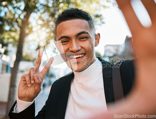 Image of Selfie, business and portrait of happy man with peace sign in city for social media, profile picture or post. Travel, professional and face of male worker with hand gesture for career, job or success