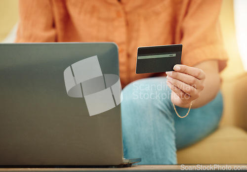 Image of Credit card, hands and laptop for online shopping in home, digital payment and fintech password for ecommerce sales. Closeup of person, computer and internet banking for budget of financial account