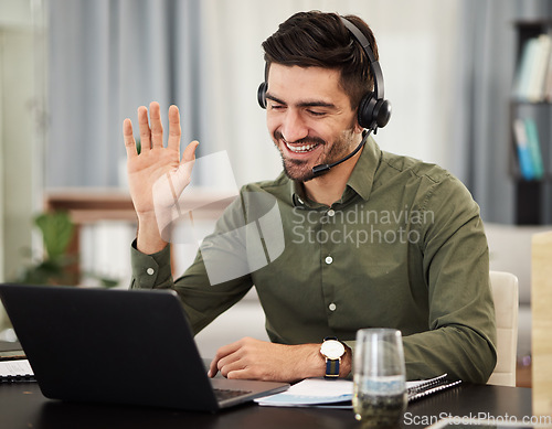 Image of Man, remote work and virtual assistant with headphones at laptop for video call, voip communication and telemarketing. Consultant wave at computer with microphone for customer support at home office