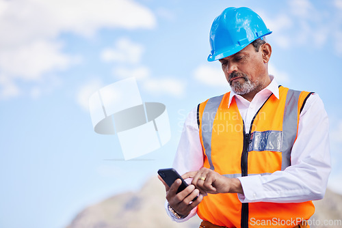 Image of Phone, construction worker and typing communication in the city for planning, building and project management with engineer. Cellphone, online conversation and senior man with internet connection
