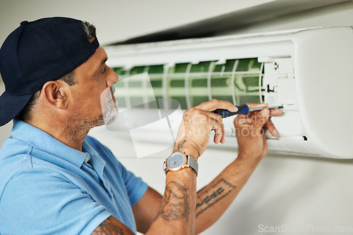 Image of Electrician, maintenance and air conditioning with man and screwdriver for ac repair, ventilation and power. Engineering, electricity and inspection with technician and tools for fan and contractor