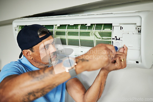 Image of Electrician, tools and air conditioner with man and screwdriver for maintenance, ventilation and power. Engineering, electricity and inspection with technician and ac repair for fan and contractor