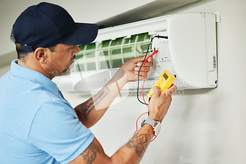 Image of Air conditioner, meter and electrician man for ac repair, maintenance and electrical power services on fan system. Person, technician or contractor with electricity, box check and hvac engineering