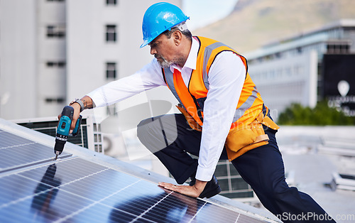 Image of Solar panels, man and power drill for engineering, grid and building maintenance in city. Electrician, construction tools and inspection of energy saving electricity, photovoltaic system and rooftop