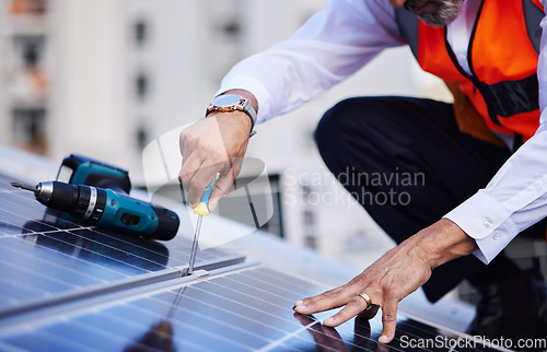 Image of Solar panels, man hands and tools for engineering maintenance, sustainability development and rooftop, Grid, screwdriver and industrial worker or electrician for eco photovoltaic installation in city