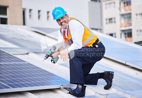 Image of Solar panels, man and portrait with drill for engineering, grid and building maintenance in city. Electrician, construction tools and smile for energy saving project, photovoltaic system and rooftop