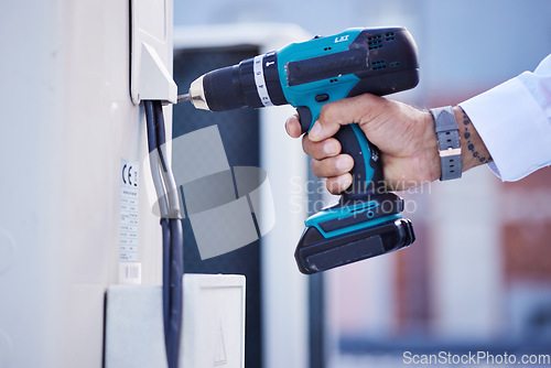 Image of Drill, air conditioning and hands of electrician outdoor for renovation of building maintenance. Closeup, construction tools and inspection of electricity, mechanic system and power for engineering