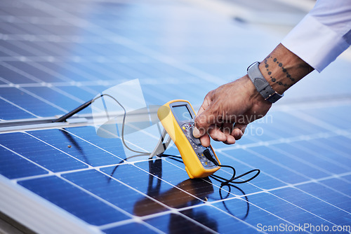 Image of Solar panels, multimeter test and hands of technician check power, engineering and maintenance. Closeup of electrician, tools and inspection of energy saving electricity, photovoltaic system and grid