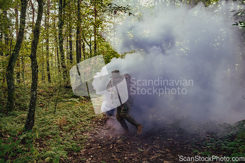 Image of Battle of the military in the war. Military troops in the smoke