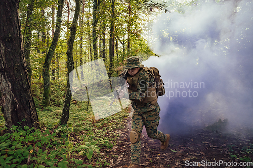 Image of Battle of the military in the war. Military troops in the smoke