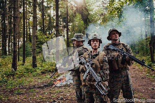 Image of Modern Warfare Soldiers Squad Running in Tactical Battle Formation Woman as a Team Leader