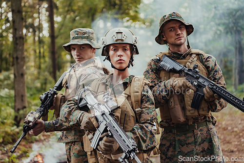 Image of Modern Warfare Soldiers Squad Running in Tactical Battle Formation Woman as a Team Leader