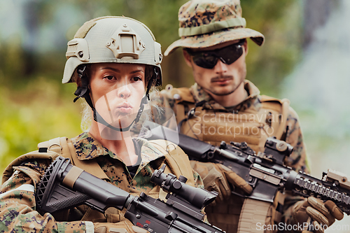 Image of Modern Warfare Soldiers Squad Running in Tactical Battle Formation Woman as a Team Leader