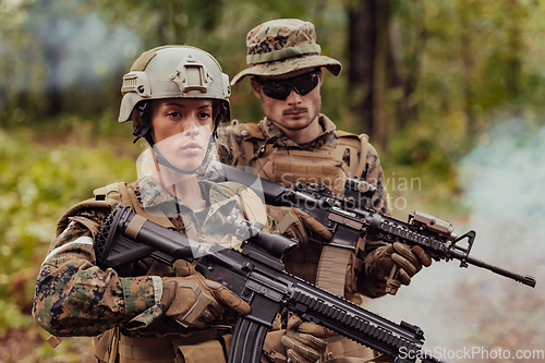 Image of Modern Warfare Soldiers Squad Running in Tactical Battle Formation Woman as a Team Leader