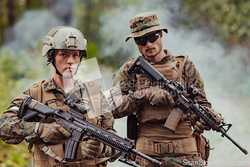 Image of Modern Warfare Soldiers Squad Running in Tactical Battle Formation Woman as a Team Leader