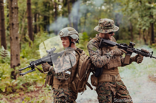 Image of Modern Warfare Soldiers Squad Running in Tactical Battle Formation Woman as a Team Leader