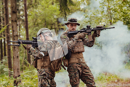 Image of Modern Warfare Soldiers Squad Running in Tactical Battle Formation Woman as a Team Leader