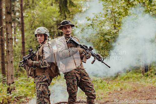 Image of Modern Warfare Soldiers Squad Running in Tactical Battle Formation Woman as a Team Leader