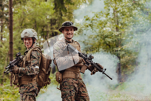 Image of Modern Warfare Soldiers Squad Running in Tactical Battle Formation Woman as a Team Leader