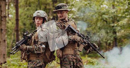 Image of Modern Warfare Soldiers Squad Running in Tactical Battle Formation Woman as a Team Leader