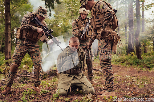 Image of Soldiers squad was capture alive terrorist and interrogation them on them on special tactics violent way