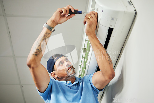 Image of Electrician, inspection and air conditioning with man and screwdriver for maintenance, ventilation and power. Engineering, electricity and ac repair with technician and tools for fan and contractor