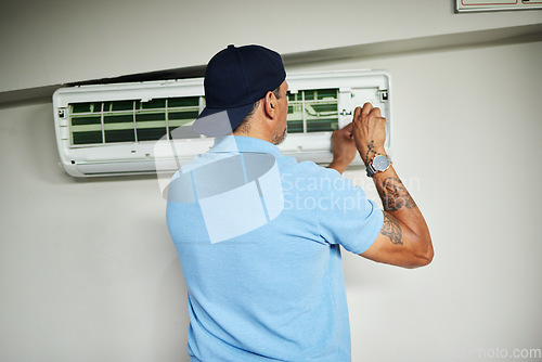 Image of Machine, ac repair and air conditioner with man and screwdriver for maintenance, ventilation or power. Engineering, electricity and inspection with technician and tools for electrician and contractor