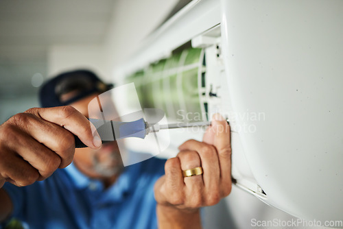 Image of Electrician, hands and air conditioning with man and screwdriver for maintenance, ventilation or power. Engineering, electricity and inspection with closeup of technician for ac repair and contractor