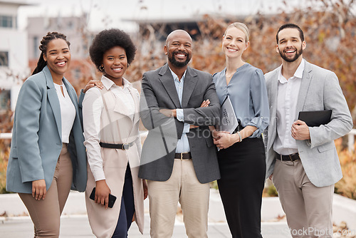 Image of Team, portrait and business people with arms crossed in the city for corporate teamwork and diversity. Smile, together and a group of employees with pride, trust and professional solidarity for work