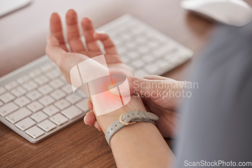 Image of Business person, wrist pain and red injury from osteoporosis, orthopedic joint and laptop typing in office. Closeup, hands and worker with carpal tunnel, fibromyalgia and muscle fatigue at computer