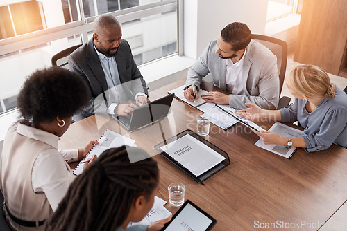 Image of Business meeting, technology and people planning, management and collaboration for financial report or proposal. Diversity women, men and manager on laptop and documents for accounting workflow above