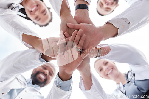 Image of Hospital doctors, happy people and circle hands together for healthcare teamwork, medical team building and clinic celebration. Solidarity, below view and group surgeon for collaboration success