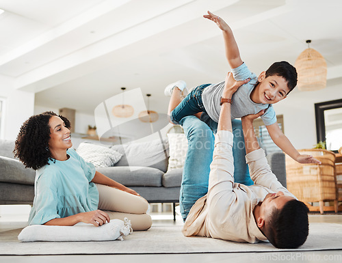 Image of Portrait, mother or child playing with father on floor relaxing as a happy family bonding in Portugal with love. Care, flying airplane game or parents smile with a kid enjoying fun time on a holiday