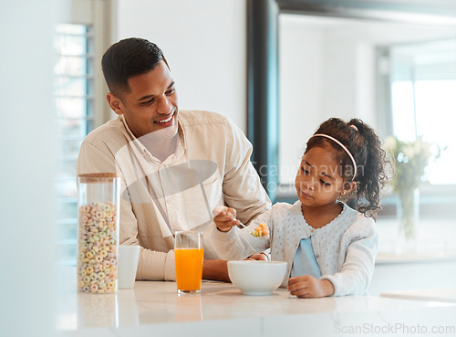 Image of Happy, morning and a child with father for breakfast, food in a kitchen and care for nutrition at home. Smile, together and a young dad with a girl kid eating cereal in a house for health and hungry