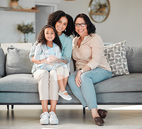 Image of Mother, grandmother and girl on sofa for portrait in living room, home or happy together for quality time or bonding in house. Smile, face of mama and elderly person to relax with young child