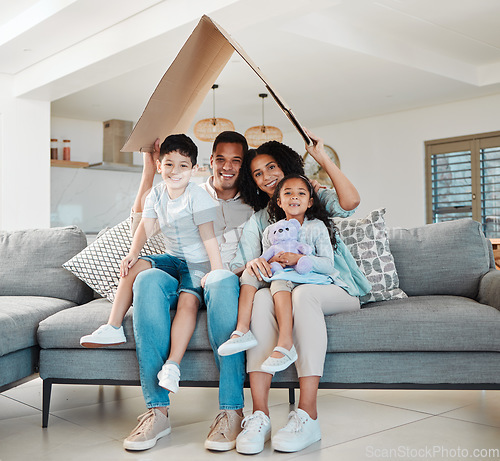 Image of Family, children and portrait for home insurance, investment on financial safety on sofa with mother and father. Parents, kids and interracial people with cardboard roof for house cover and security