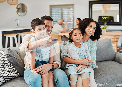 Image of Remote, relax and happy family watching tv show, movie or decision on broadcast, kids entertainment or film. Lounge, channel surfing choice and home children, mother and father view television series