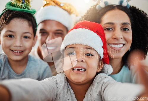 Image of Parents, kids and christmas selfie in family home, smile and excited for event, culture and celebration together. Mom, dad and young children with xmas memory, photography or profile picture on blog