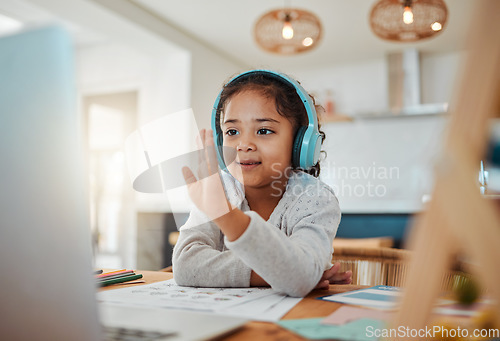 Image of Video call, laptop and child for e learning, online class and home education, translation and listening on headphones. Happy kid or girl waves hello on computer, teaching platform and virtual school