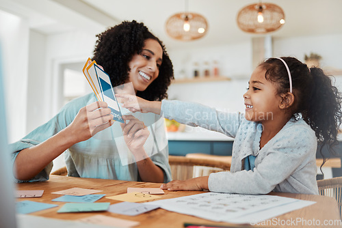 Image of Homework, education and mother with girl with cards for learning, child development and studying. Family, school and happy mom with kid at table with paper for creative lesson, growth and knowledge
