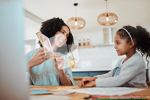 Image of Homework, learning and mother with girl with card for education, child development and studying. Family, school and happy mom with kid at table with paper for creative lesson, teaching and knowledge