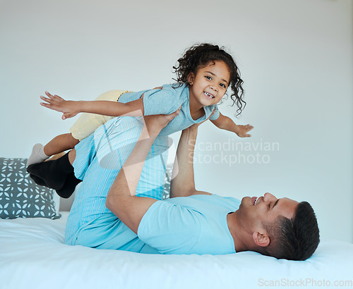 Image of Bedroom, airplane and portrait of father playing with child for quality time, fun or happiness at home. Happy, smile and young dad relaxing with boy kid in a superhero costume on bed at family house.