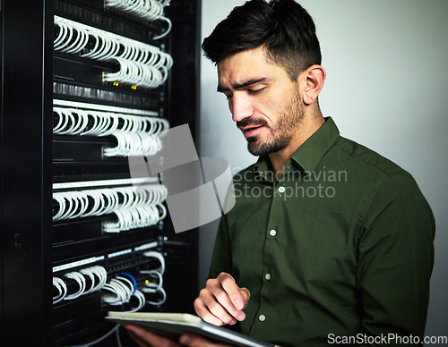 Image of Engineer man, cable and tablet in server room for programming, maintenance and software upgrade. Serious technician person with technology in data center for wire, hardware and internet connection