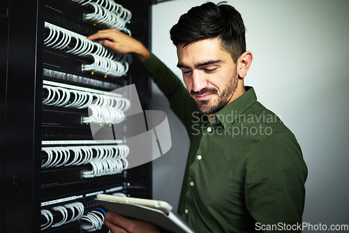 Image of Cable, engineer man and data center with a tablet for programming, maintenance and software upgrade. Male IT technician person with technology in server room for wire, hardware or internet connection