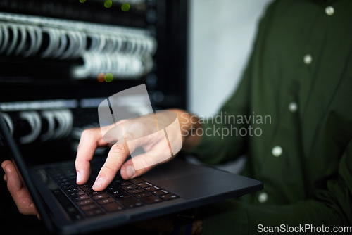 Image of Server room hands, laptop and technician at work for cyber security and building network. Programming, coding and a person or it worker with a computer for a connection system in the workplace