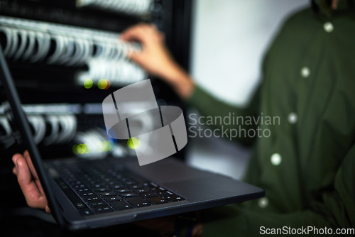 Image of Server room maintenance, laptop and technician at work for cyber security and building network. Programming, coding and a person or it worker with a computer for a connection system in the workplace