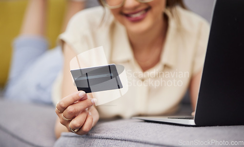 Image of Hands of woman, credit card and ecommerce on laptop in home for digital payment, fintech password and online shopping. Closeup of customer, computer and banking code for financial investment account