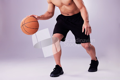 Image of Fitness, basketball and bounce with a sports man in studio on a gray background for training or a game. Exercise, workout or dribble and healthy body of shirtless male athlete playing ball with skill