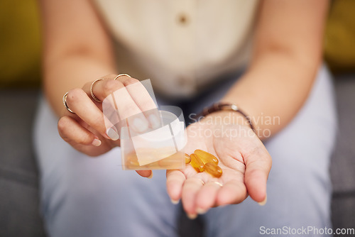 Image of Hands, pills and a person with fish oil for health, wellness and medicine for diet. Closeup, bottle and a woman with medication or a healthcare supplement in the morning for medical goals or support