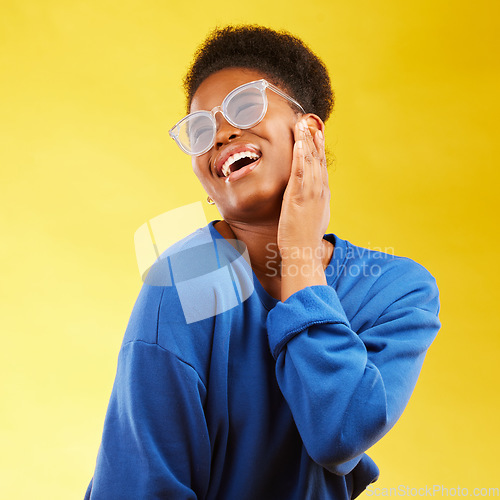 Image of Fashion, freedom and excited with a black woman on a yellow background in studio for trendy gen z style. Relax, smile and fun with a happy young girl indoor to dance with a carefree expression